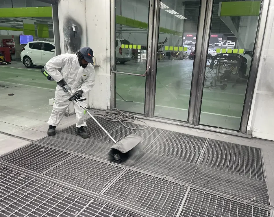 Worker cleaning floor